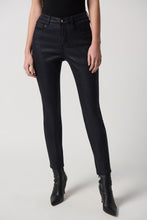 Load image into Gallery viewer, Black skinny jeans made from a sleek fabric. Perfect for a stylish and slimming look.
