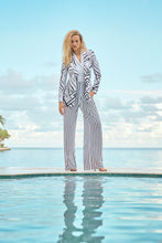 Load image into Gallery viewer, Timelessly fashionable woman in sleek striped pants, showcasing a wide waistband and a chic sash.