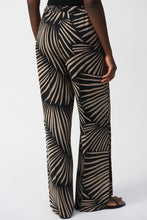 Load image into Gallery viewer, Chic gauze pants showcasing a tropical print, wide-leg silhouette, side slits, and practical side pockets for a polished appearance.