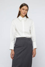 Load image into Gallery viewer, Elevate your style with a white beaded lapel shirt and a sleek grey skirt, perfect for any elegant occasion.