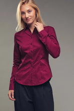 Load image into Gallery viewer, Woman wearing a burgundy shirt against a gray background