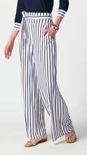 Load image into Gallery viewer, Elegant woman donning striped wide-leg pants with a fashionable waistband and chic sash.