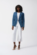 Load image into Gallery viewer, Stylish culotte jeans with four pockets, embellished front seam, and trendy slit and frayed hem for a sophisticated look.