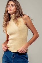 Load image into Gallery viewer, Woman wearing a beige ribbed tank top and blue jeans against a gray background