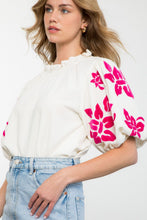 Load image into Gallery viewer, Elevate your style with the Alice Corduroy Top, featuring a white blouse adorned with pink flowers. This cozy yet fashionable top is perfect for those who dare to be bold.