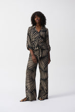 Load image into Gallery viewer, Exquisite gauze pants featuring a tropical print, wide-leg design, side slits, and functional pockets for an elegant touch.

