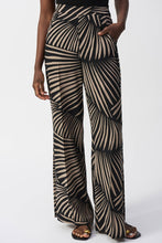 Load image into Gallery viewer, Luxurious gauze pants adorned with a tropical print, wide-leg silhouette, side slits, and stylish pockets for a refined appearance.
