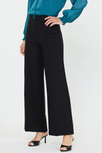 Load image into Gallery viewer, Person wearing black wide-leg pants with a teal top on a white background
