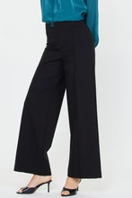 Load image into Gallery viewer, Black wide-leg pants worn with a teal top on a white background
