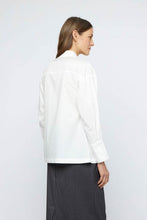 Load image into Gallery viewer, Luxurious white cotton poplin shirt with delicate beading, long sleeves, and double button cuffs, ideal for any elegant affair.
