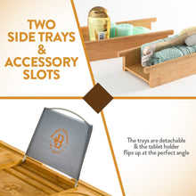 Load image into Gallery viewer, Eco-friendly bamboo caddy tray with extendable sides, mobile device tray &amp; wine holder for a relaxing bath experience.
