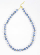 Load image into Gallery viewer, Blue beaded necklace with gold accents on a white background
