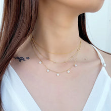 Load image into Gallery viewer, Triple chain necklace with 5 stations of simulated white diamonds in prong circles.
