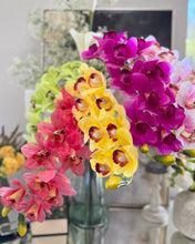Load image into Gallery viewer, Enhance your centerpieces with a stunning vase of real touch Cymbidium orchids in vibrant hues, exuding elegance.
