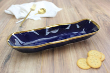 Load image into Gallery viewer,  Luxurious blue glazed porcelain with gold-tone rims. Perfect for bread, crackers, or cookies. Food safe, easy to clean.
