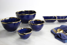Load image into Gallery viewer, Sunset by the sea snack bowl in blue glazed porcelain with gold-tone rims. Great for nuts, berries, candies, and dip. Food safe, dishwasher safe, oven safe to 500°.
