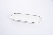 Load image into Gallery viewer, Medium Oval Tray from Bianca Collection: Gleaming white porcelain with silver rim. Perfect for serving baguette, mushrooms, fruit, asparagus, carrots, and green beans. Food, dishwasher, and oven safe. Easy care.
