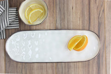 Load image into Gallery viewer, Bianca Collection oval tray: ideal for baguette, mushrooms, fruit, asparagus, carrots, green beans. White porcelain with silver rim. Food, dishwasher, oven safe.
