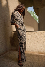 Load image into Gallery viewer, Effortlessly sophisticated gauze pants with a tropical print, wide-leg cut, side slits, and sleek side pockets for a polished look.
