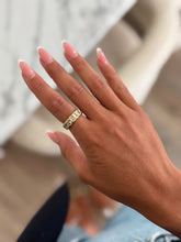 Load image into Gallery viewer, A gold band ring with clear gemstones. A statement and everyday piece to add to your stack or rotation.
