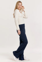 Load image into Gallery viewer, Fitted long sleeve V-neck rib tee in solid color, designed for comfort and versatility with a soft, cozy finish.
