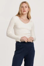 Load image into Gallery viewer, Long sleeve V-neck top in solid color, featuring a cozy ribbed texture and edge hem, perfect for versatile styling.
