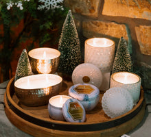 Load image into Gallery viewer, 8oz winter wonderland candle by aqua de soi in glass container, staged.
