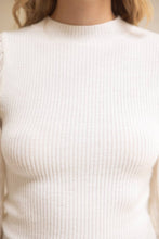 Load image into Gallery viewer, White sleeveless sweater worn by a person with a neutral background
