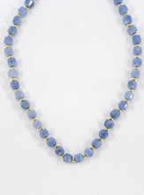 Load image into Gallery viewer, Necklace with blue beads on a white background
