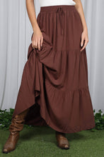 Load image into Gallery viewer, Brown tiered skirt worn by a person on a white curtain background
