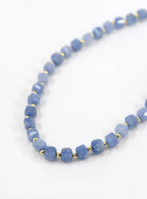 Load image into Gallery viewer, Blue beaded necklace with gold accents on a white background

