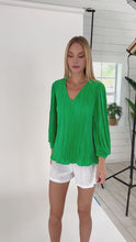 Load and play video in Gallery viewer, Stand out in style with the Gale Top Green Plisse by Julian Chang. This unique top features a vibrant green plisse design, perfect for adding a touch of color to your ensemble. Crafted from high-quality materials, it ensures both a fashionable look and comfortable feel.
