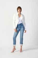 Load image into Gallery viewer, Elevate your style with this stunning white jacket, worn by a woman in jeans. The soft foiled suede and intricate guipure floral appliqué with statement studs make it a unique and practical fashion statement.
