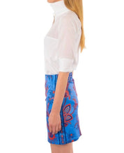 Load image into Gallery viewer, Woman in white shirt and floral pants, showcasing our high-quality white cotton voile tops in various styles and sizes.
