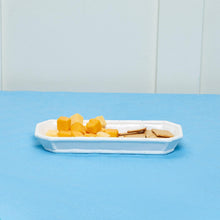 Load image into Gallery viewer, A ceramic dish designed for corn on the cob, but can also be used for appetizers. The white color complements any interior.

