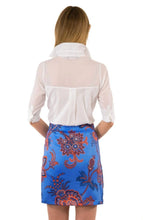 Load image into Gallery viewer, A woman donning a white shirt and floral pants, discovering our wide selection of long-lasting white tops of premium quality for any outfit and occasion.
