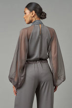 Load image into Gallery viewer, Chic and sassy Tie-Neck Raglan Blouse from Lola &amp; Sophie. Unique twist with see-through arms and fun touch of a neck tie. Spice up your wardrobe and wow everyone!
