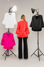Load image into Gallery viewer, Make a sophisticated statement with the Tangerine Puff Sleeve top. Crafted from sumptuous Posh Couture fabric, perfect for special occasions.
