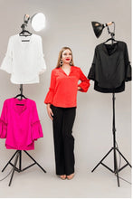 Load image into Gallery viewer, Add a burst of color to your wardrobe with the Tangerine Puff Sleeve top. Made from luxurious Posh Couture fabric for an elegant look.
