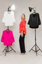 Load image into Gallery viewer, Tangerine Puff Sleeve top: Luxuriously colored blouse in vibrant tangerine, made from sumptuous Posh Couture fabric. Elegant and fashion-forward, it adds a powerful and sophisticated statement to any occasion.
